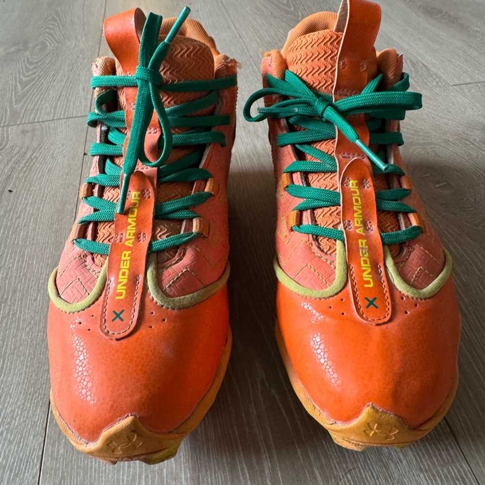 Under Armour Kids' Jaritos Orange baseball cleats with Green Laces